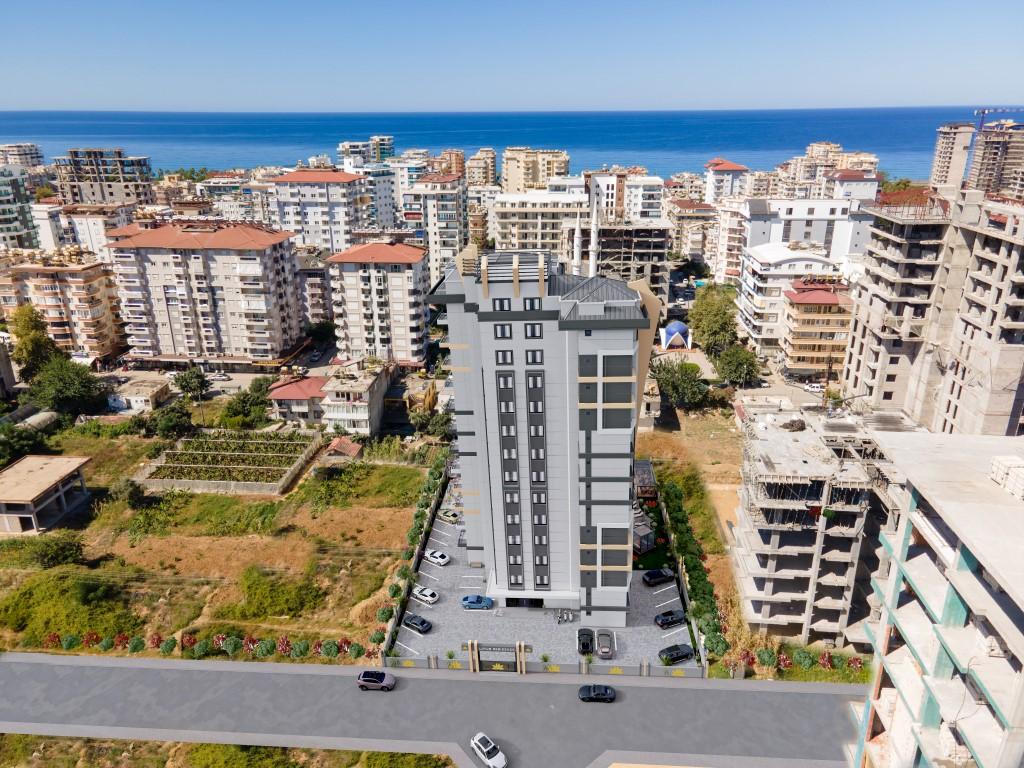 High-rise residential complex with 1+1 and 2+1 apartments in Mahmutlar district - Umbrella Group - Photo 3