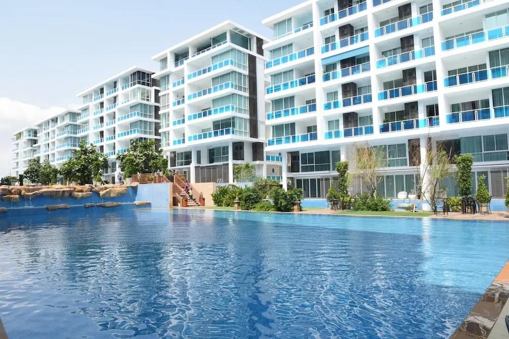 New residential complex with large outdoor pool - Umbrella Group