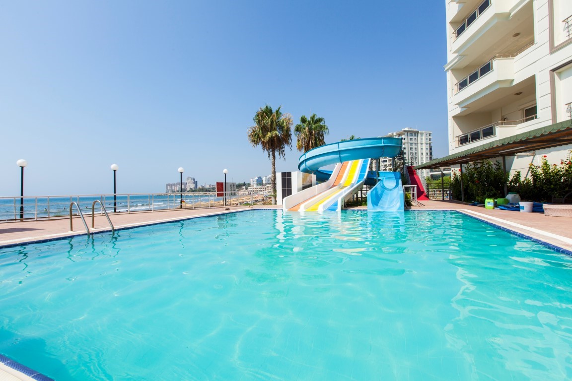 New cozy residential development near the sea in the Erdemley area, with 1+1 and 2+1 apartments - Umbrella Group - Photo 28