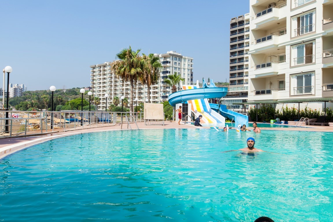 New cozy residential development near the sea in the Erdemley area, with 1+1 and 2+1 apartments - Umbrella Group - Photo 27