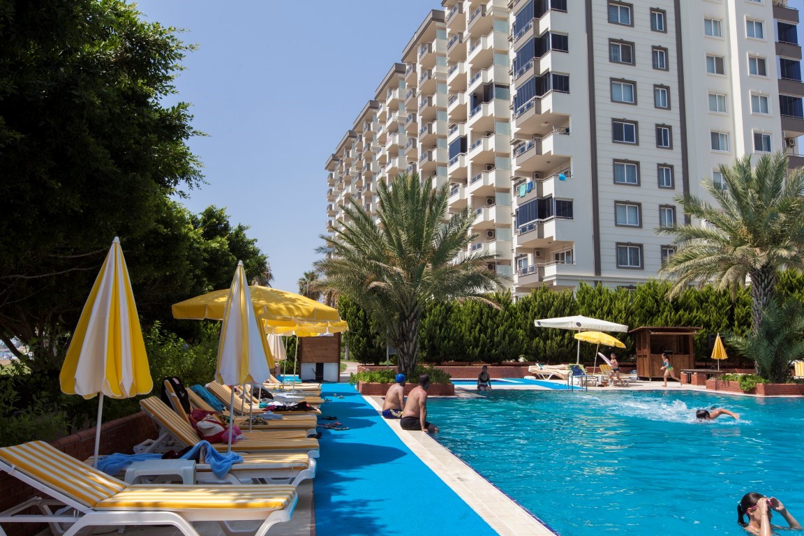 New cozy residential development near the sea in the Erdemley area, with 1+1 and 2+1 apartments - Umbrella Group - Photo 29