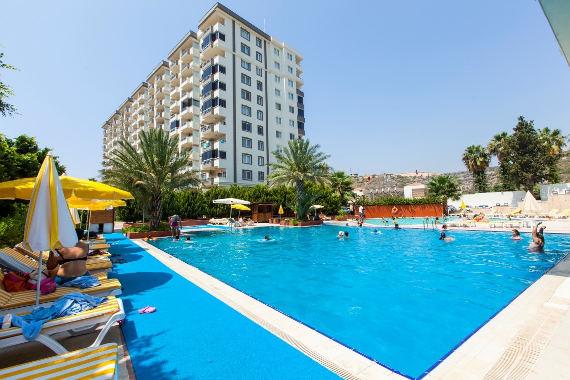 New cozy residential development near the sea in the Erdemley area, with 1+1 and 2+1 apartments - Umbrella Group - Photo 33