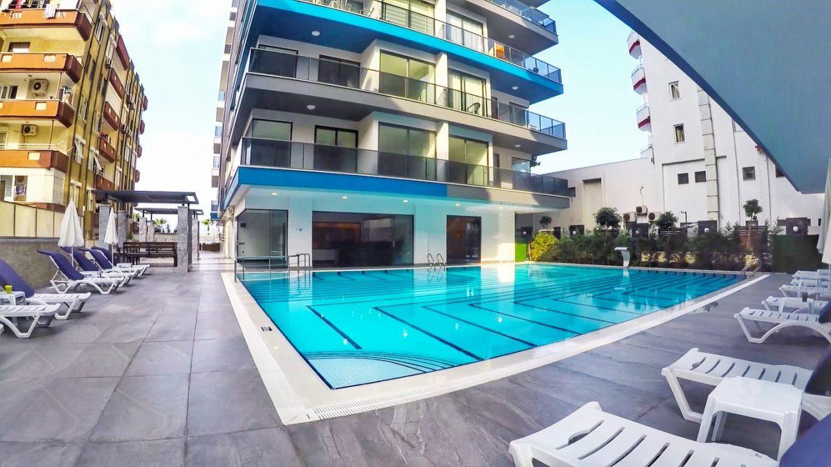 One bedroom apartment on the first coastline in the Mahmutlar area - Umbrella Group - Photo 2