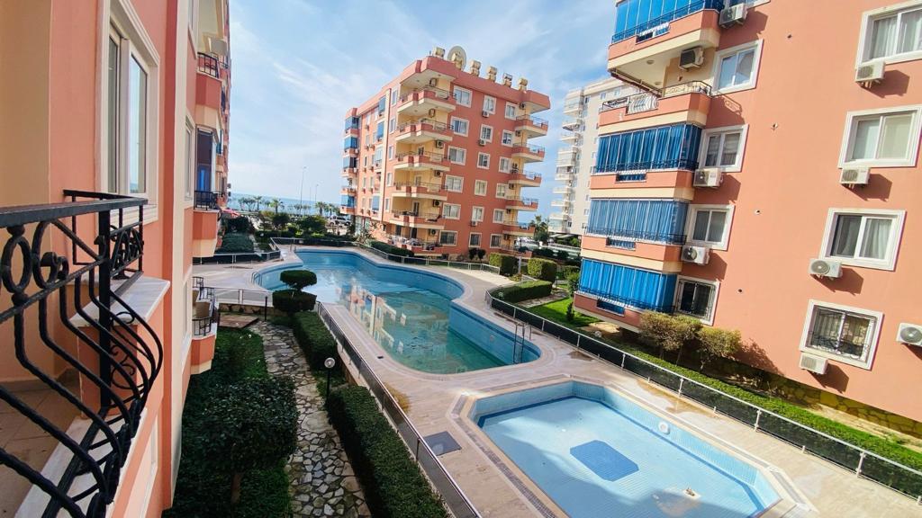 Apartment planning 2+1 on the first coastline in Mahmutlar - Umbrella Group - Photo 16