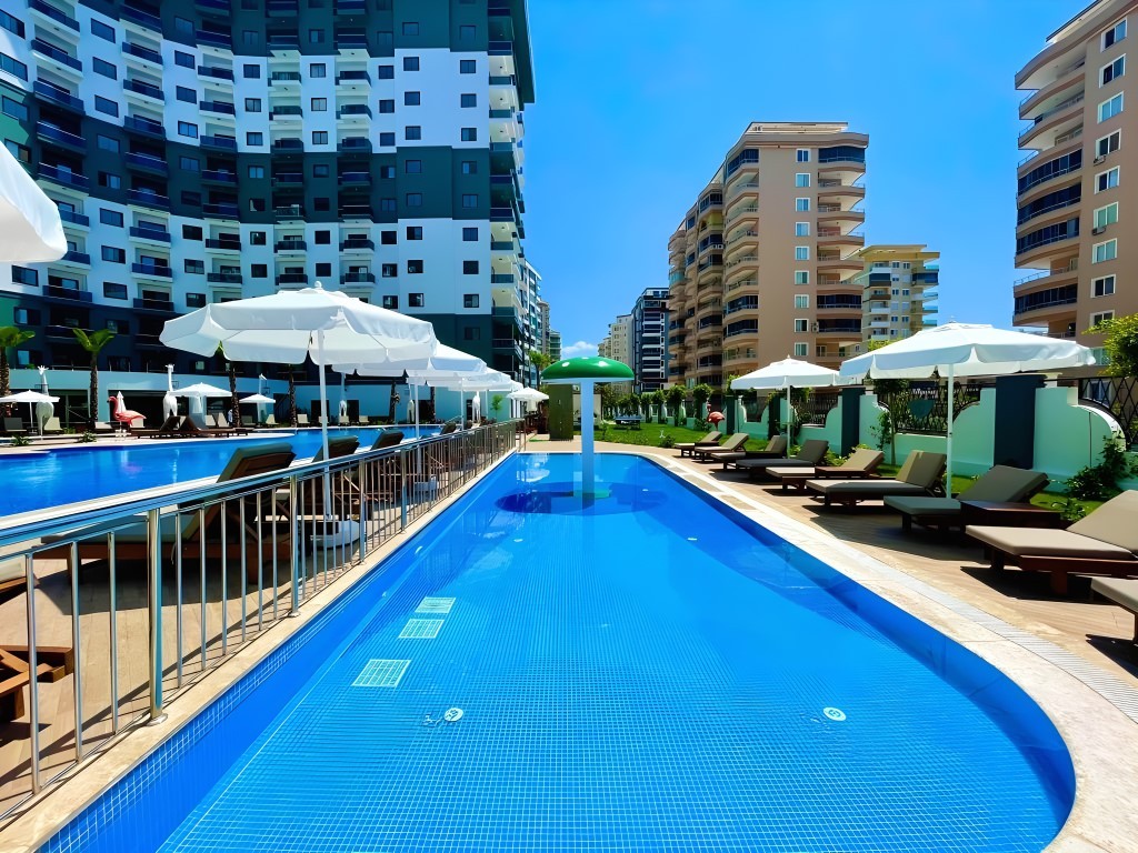 Two-room apartment of 55 m2 in complex with hotel infrastructure, Mahmutlar - Umbrella Group - Photo 3