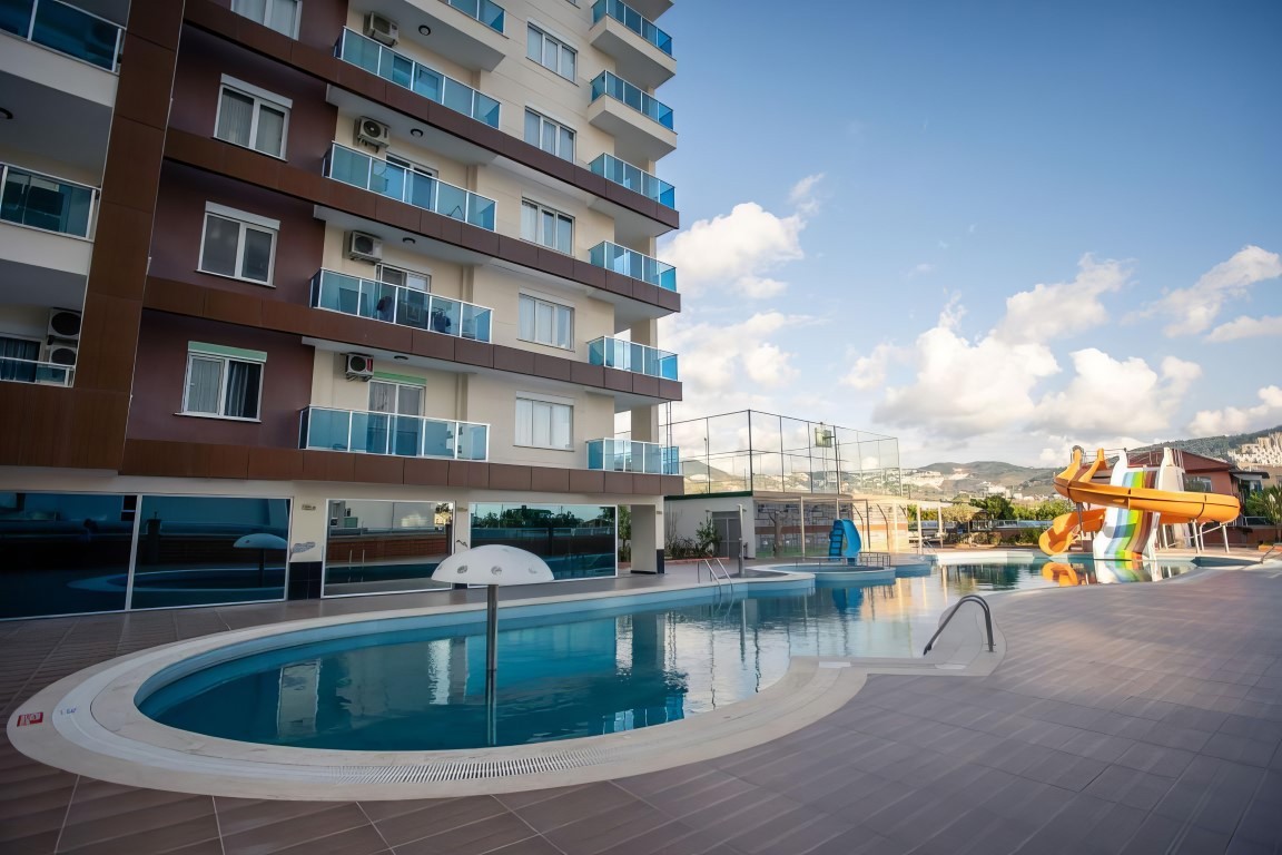 Furnished one bedroom apartment 70 m2 in the district of Mahmutlar - Umbrella Group - Photo 19
