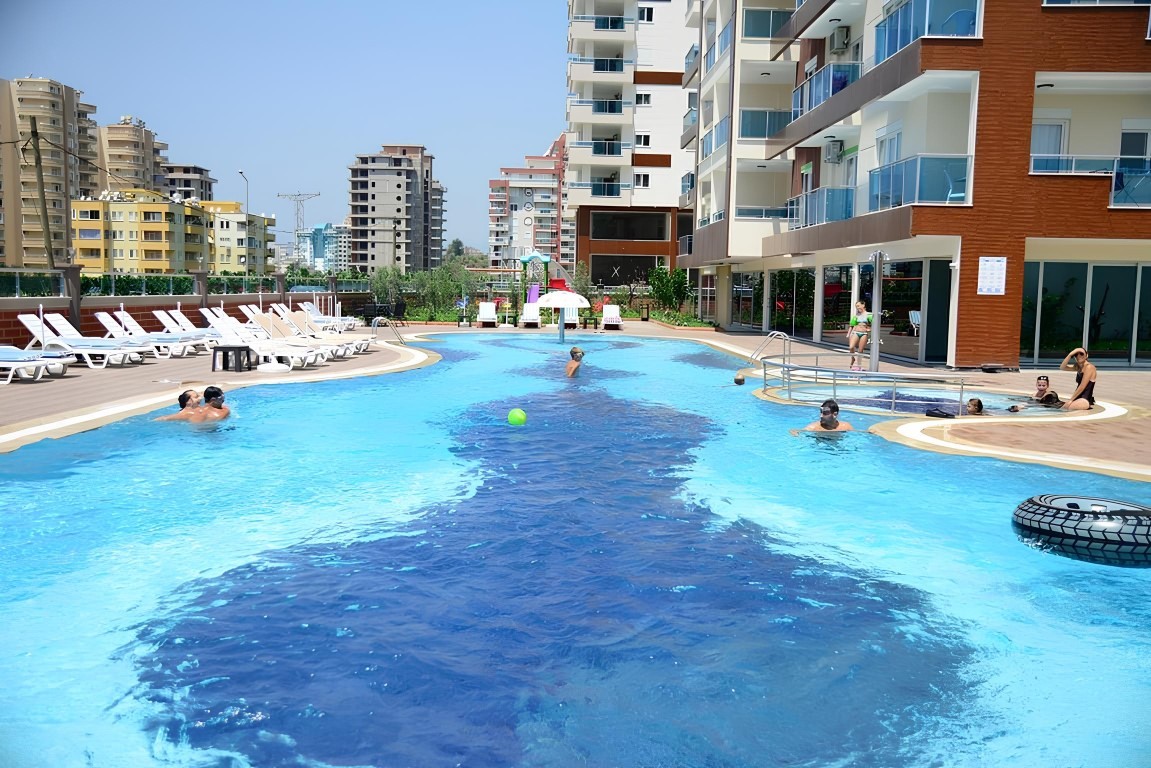 Furnished one bedroom apartment 70 m2 in the district of Mahmutlar - Umbrella Group - Photo 18